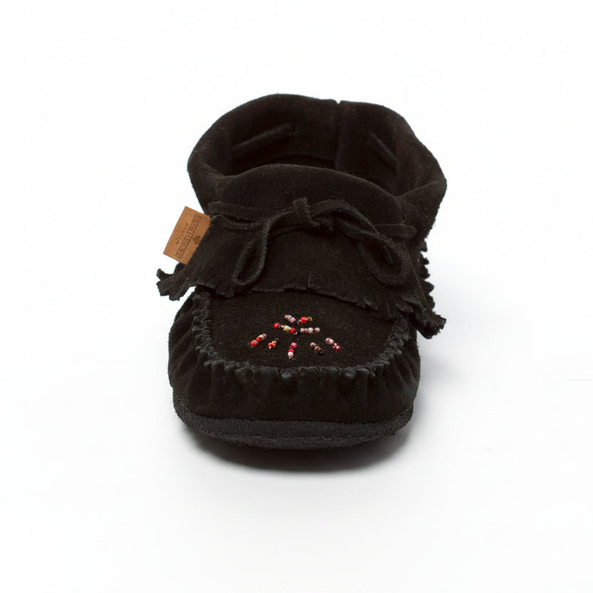 Black moccasin shoe with a bow on a white background