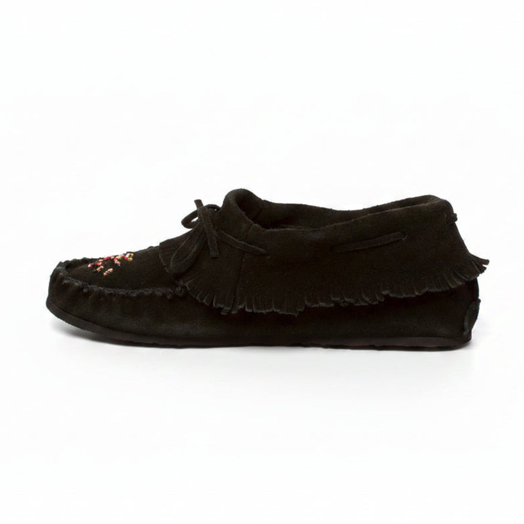 Black moccasin-style shoe with ruffled design on a white background