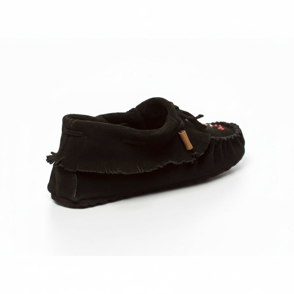 Black slipper with a textured sole on a white background