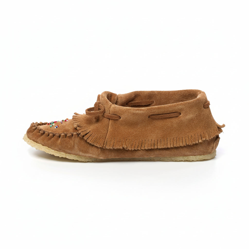 Brown moccasin slipper with fringes on a white background