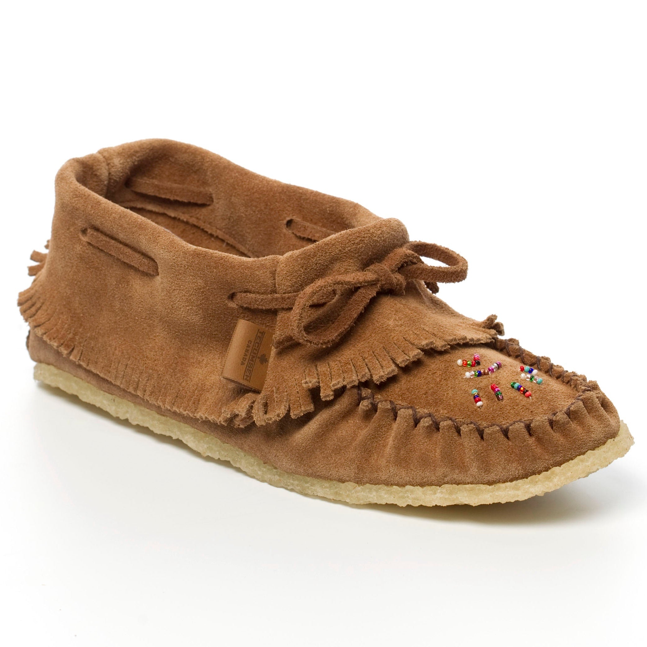 Brown moccasin slipper with decorative elements on a white background