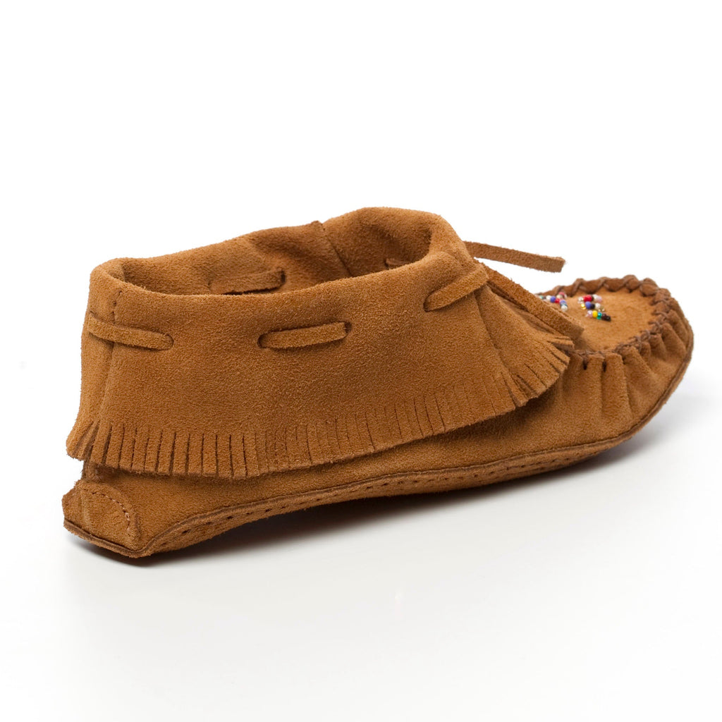 Brown moccasin slipper with fringes on a white background
