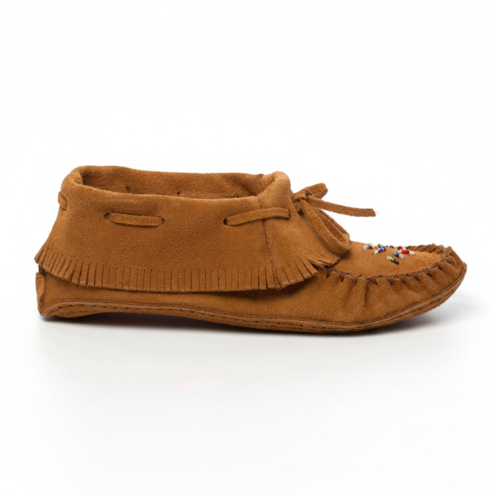 Brown suede moccasin shoe on a white background
