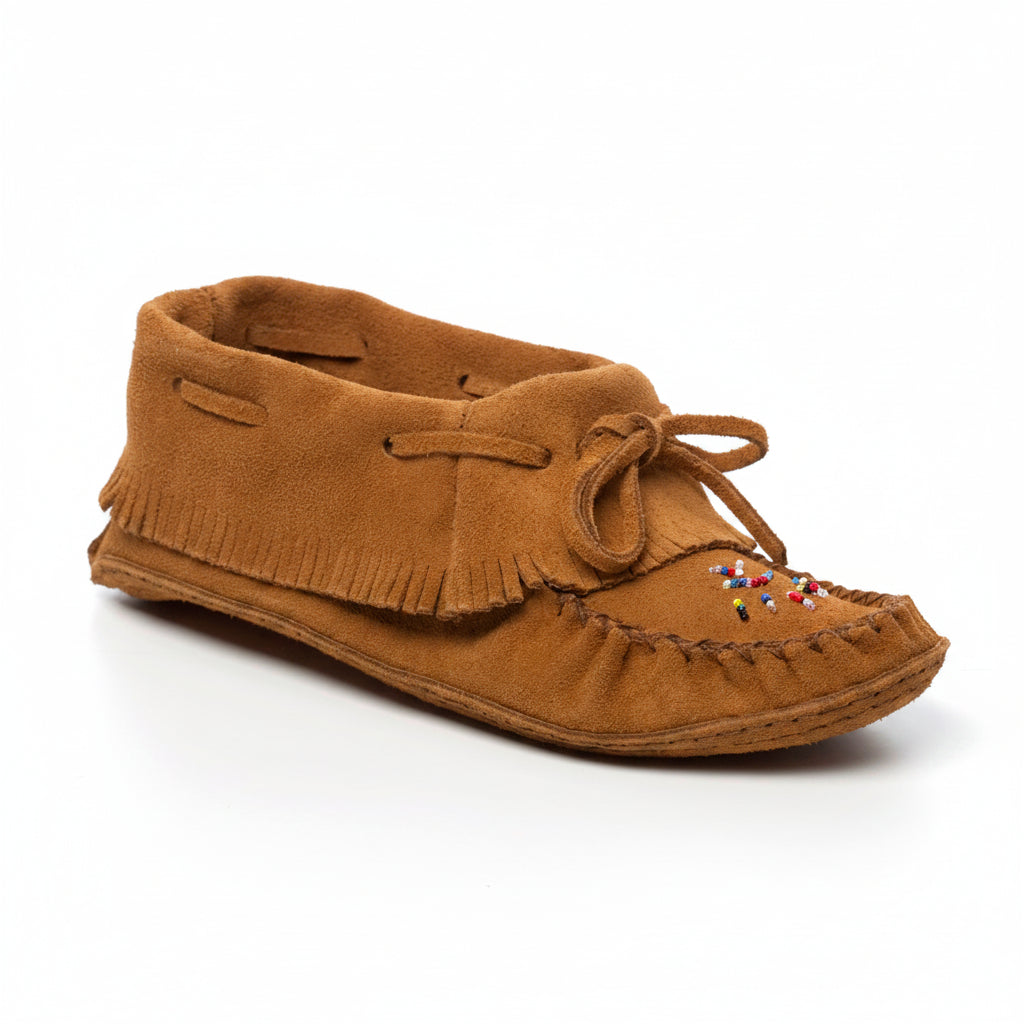 Brown moccasin shoe with fringes on a white background