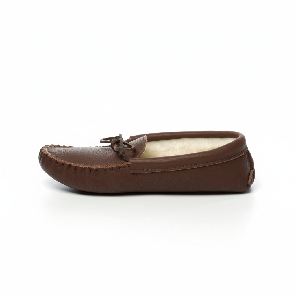 Brown leather moccasin slipper on a white background