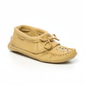 Beige moccasin shoe with fringes on a white background
