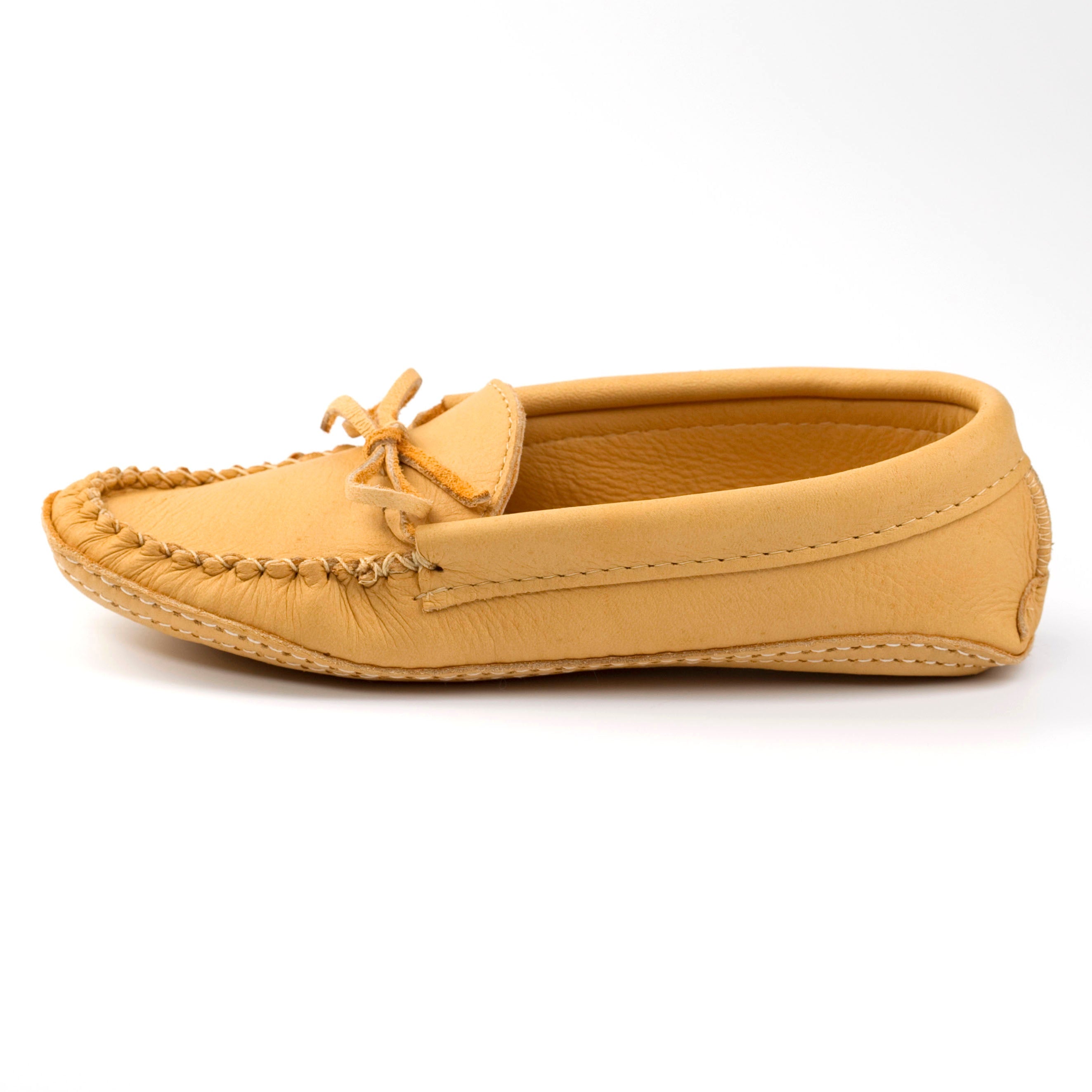 Tan moccasin shoe on a white background