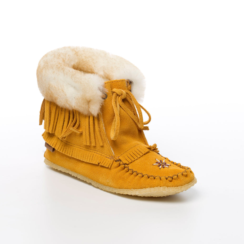 Yellow moccasin boot with white fur lining on a white background