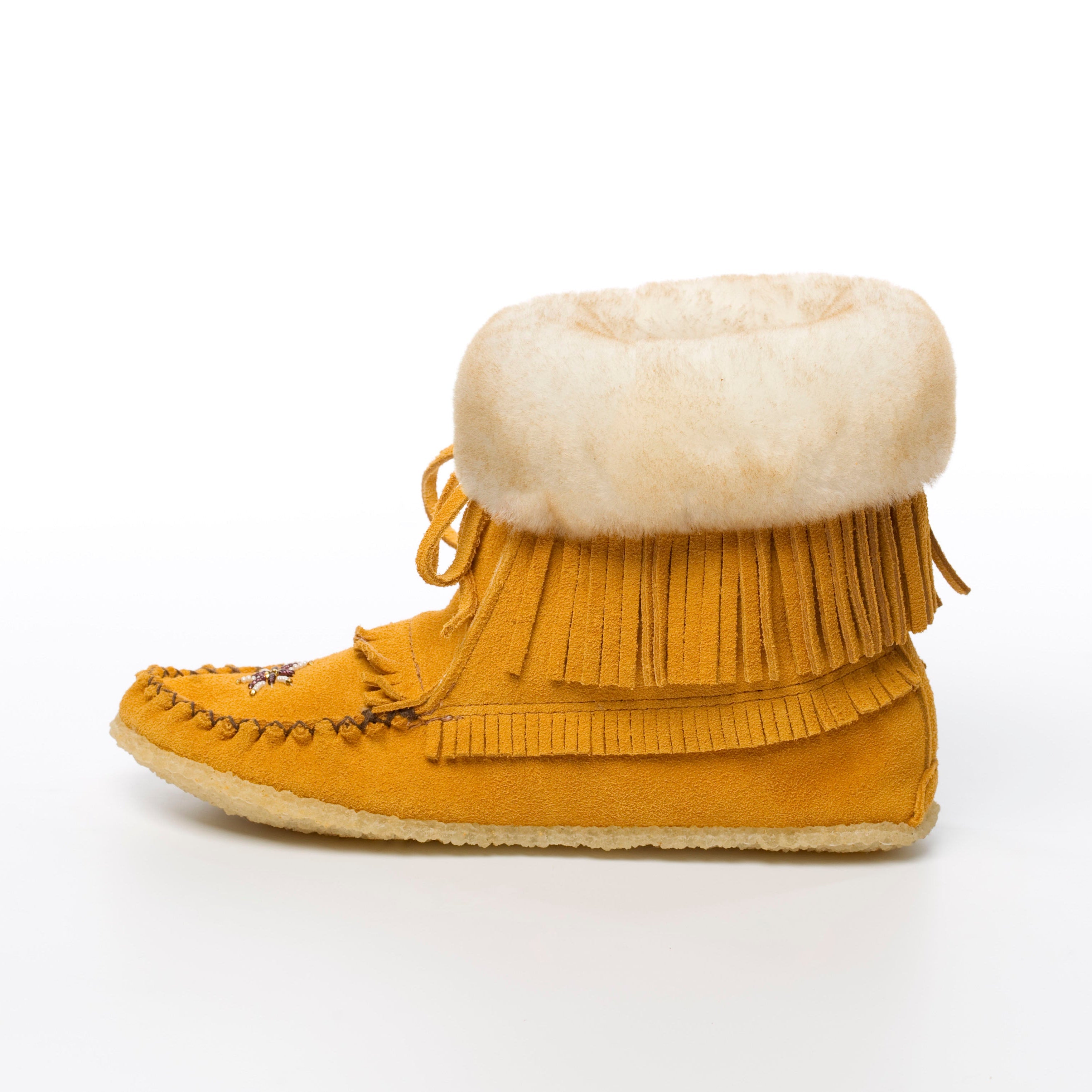 Yellow moccasin boot with white fur lining on a white background