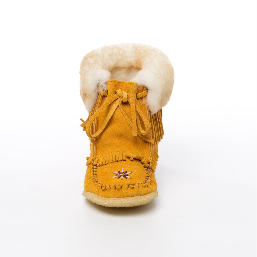 Yellow moccasin boot with white fur lining on a white background
