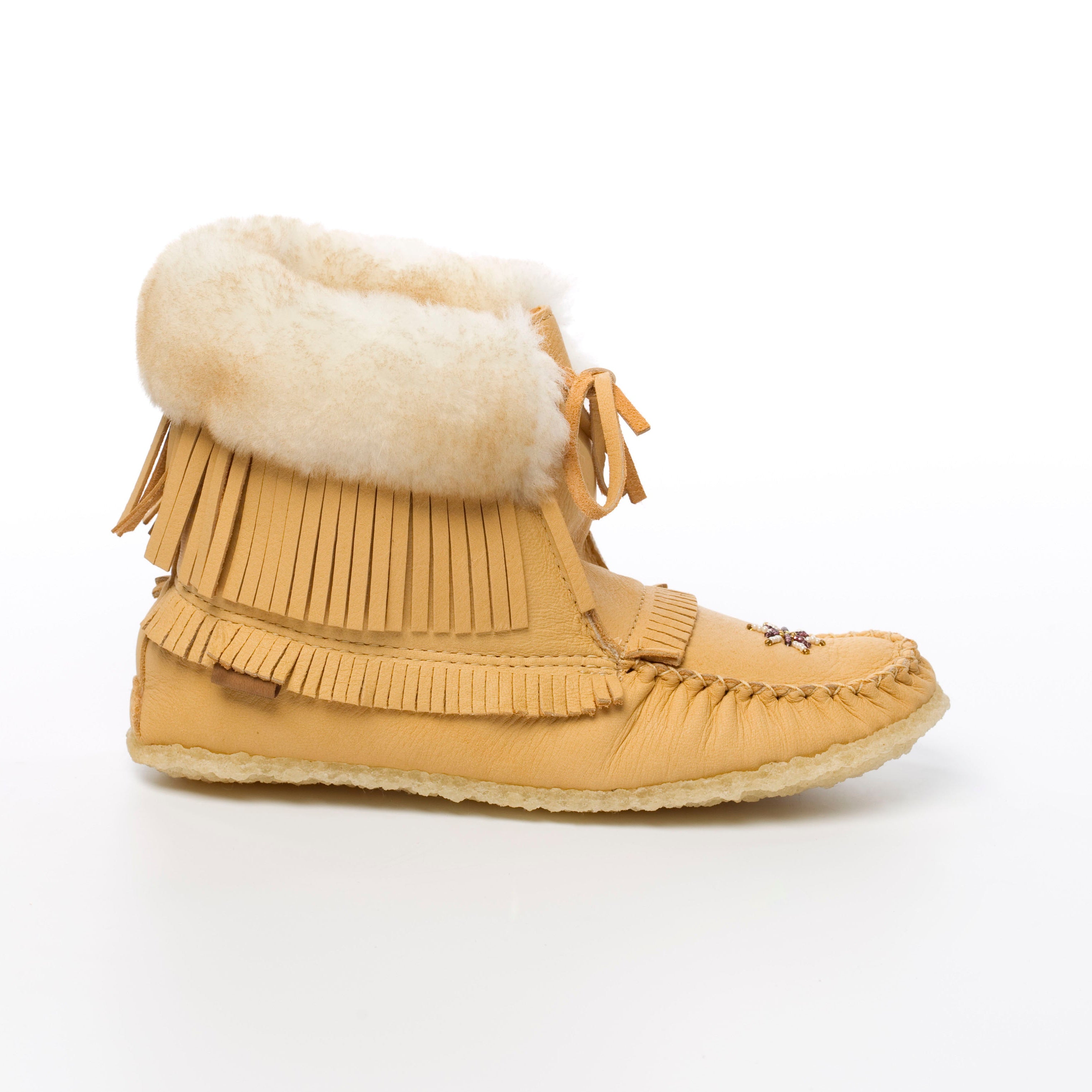 Moosehide moccasin boot with fringes and white fur lining on a white background