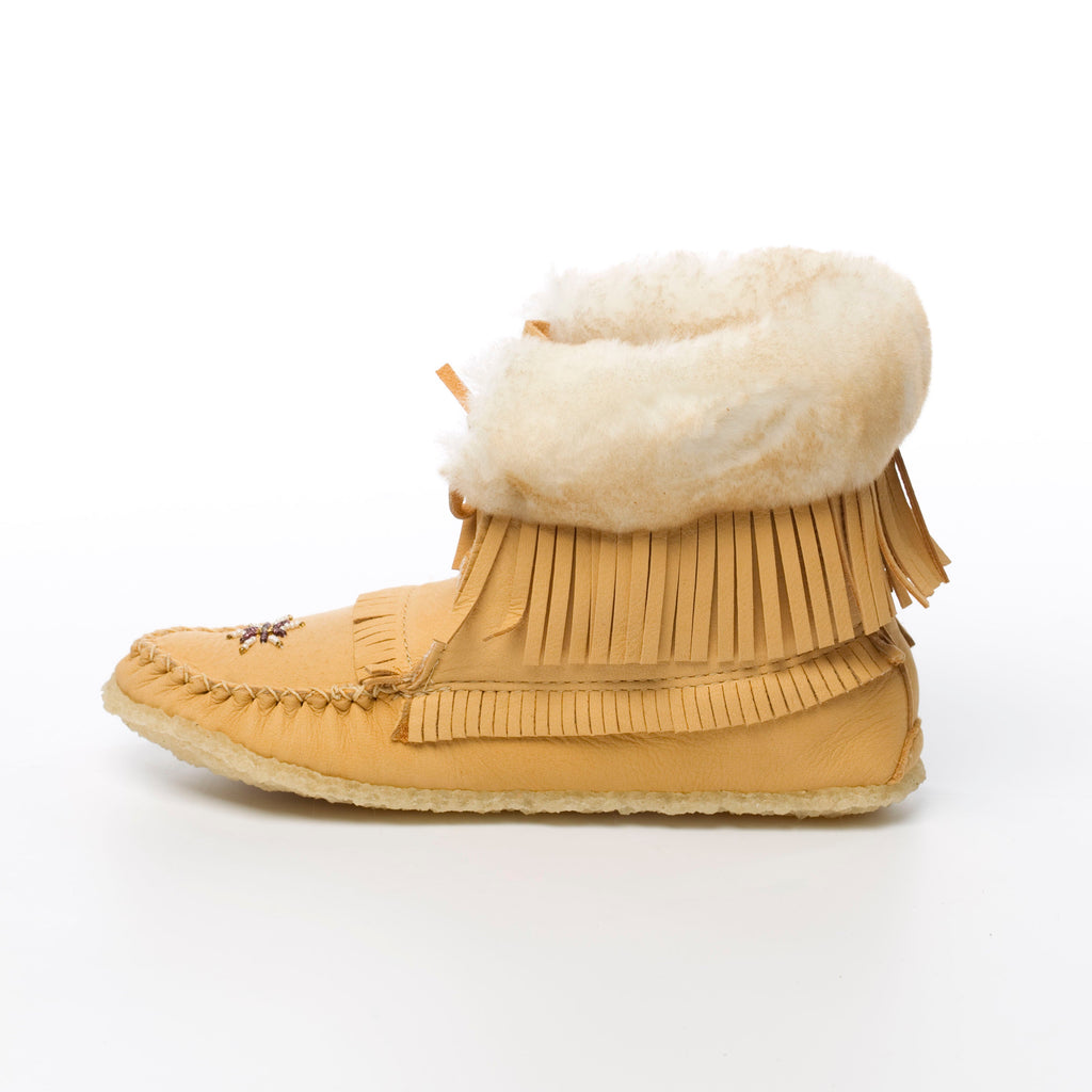 Moose Tan moccasin boots with white fur sheepskin lining and fringes on a white background