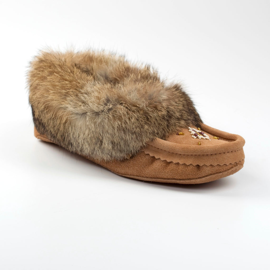 Brown moccasin slipper with fur trim on a white background