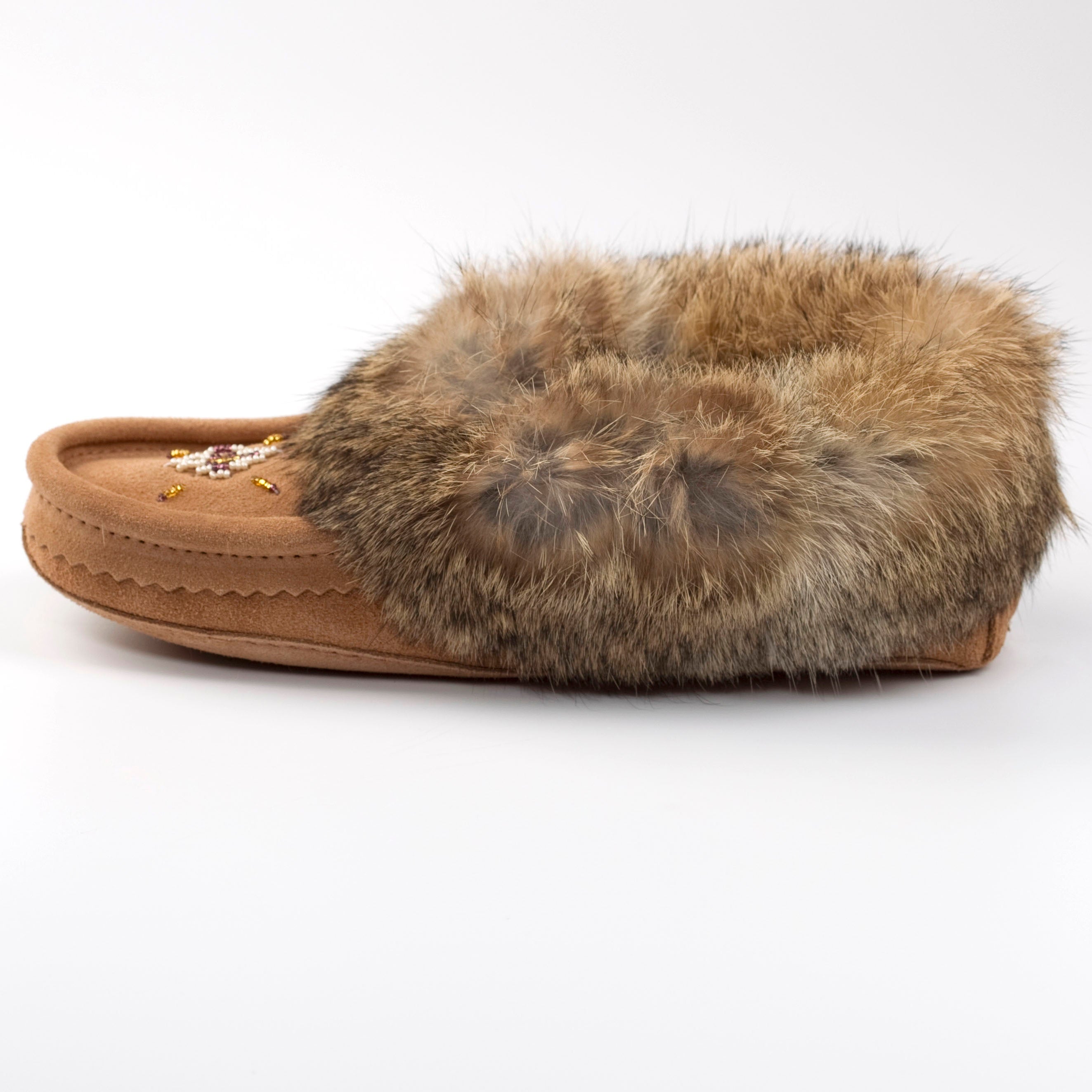 Brown slipper with fur trim on a white background