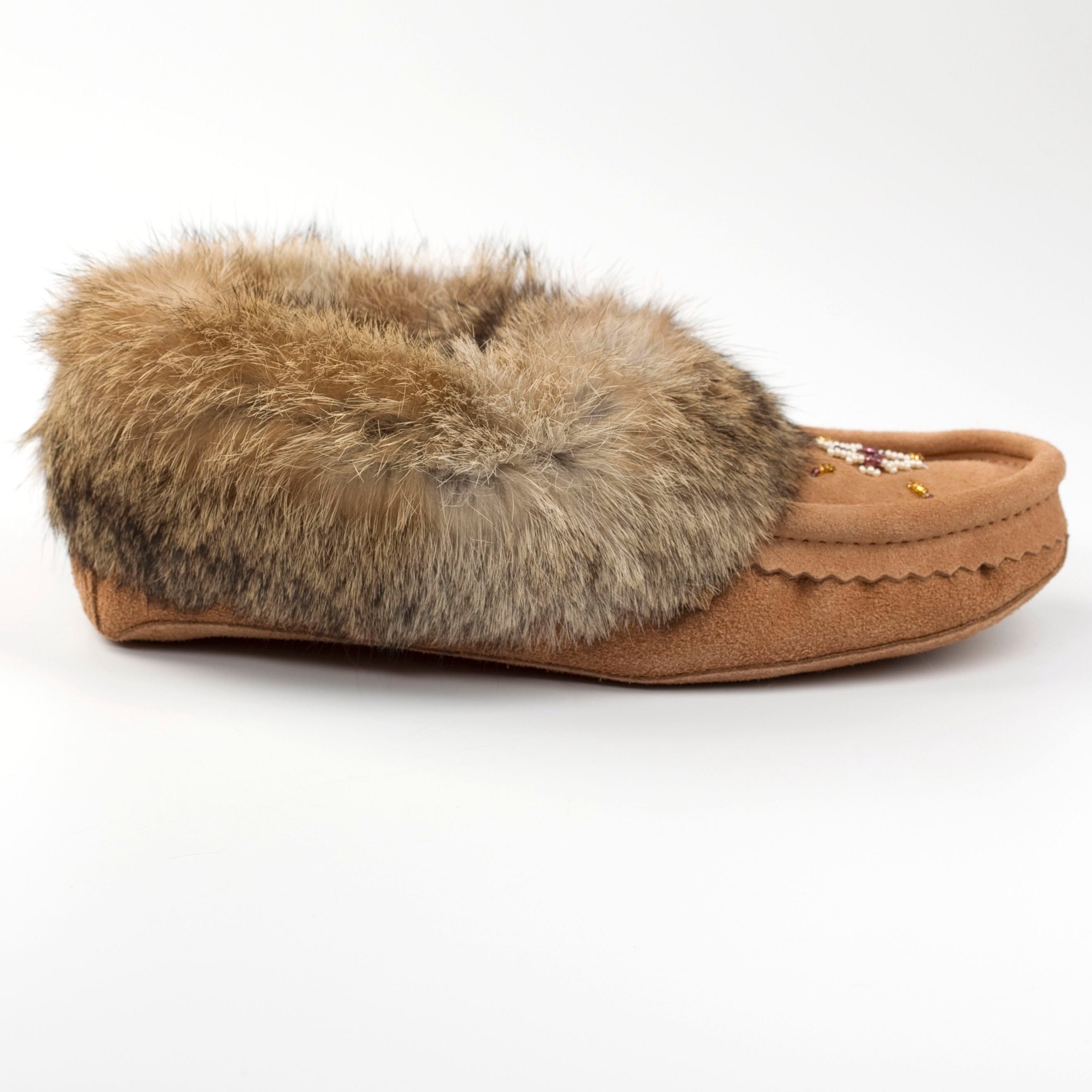 Brown slipper with fur trim on a white background