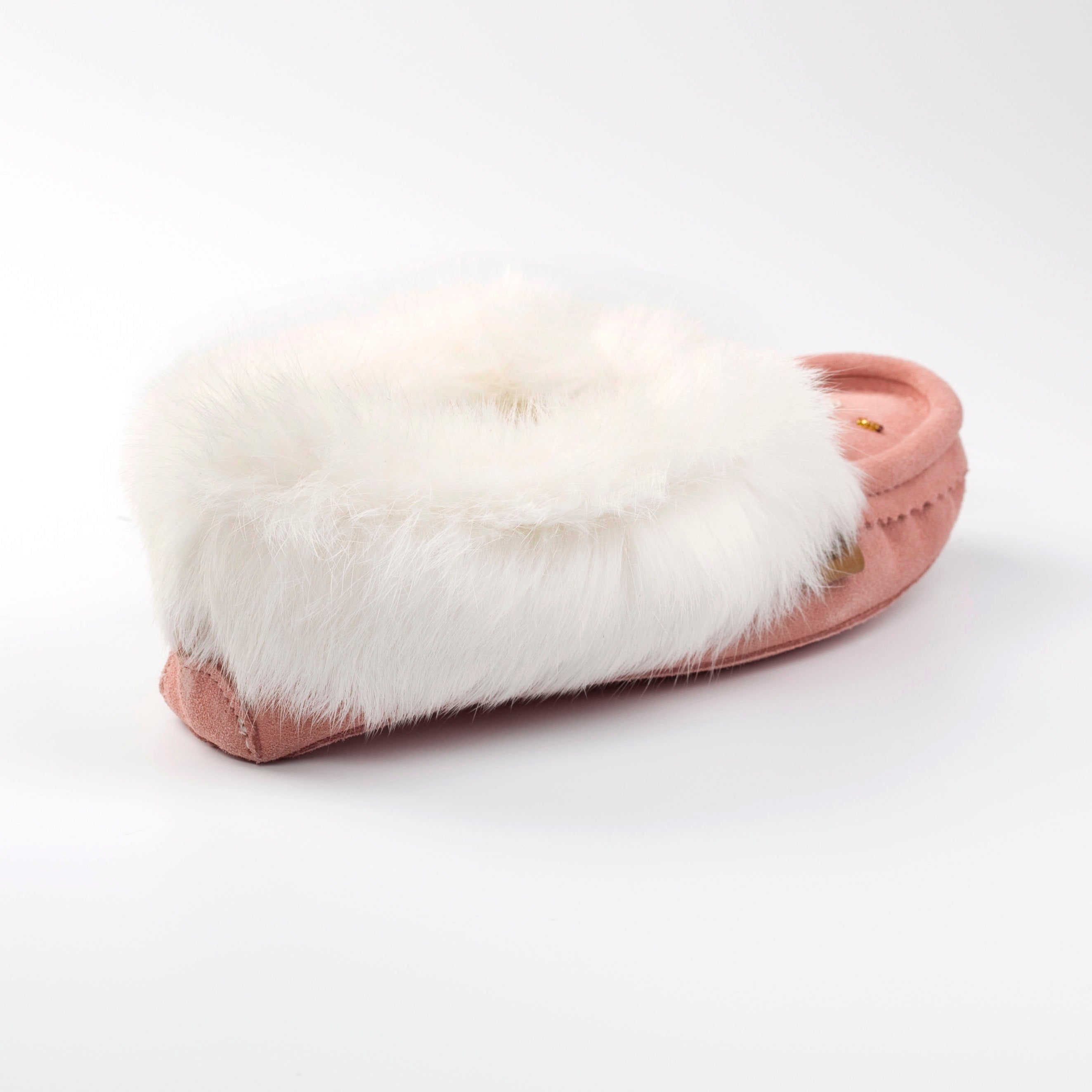 Pink slipper with white fur lining on a white background