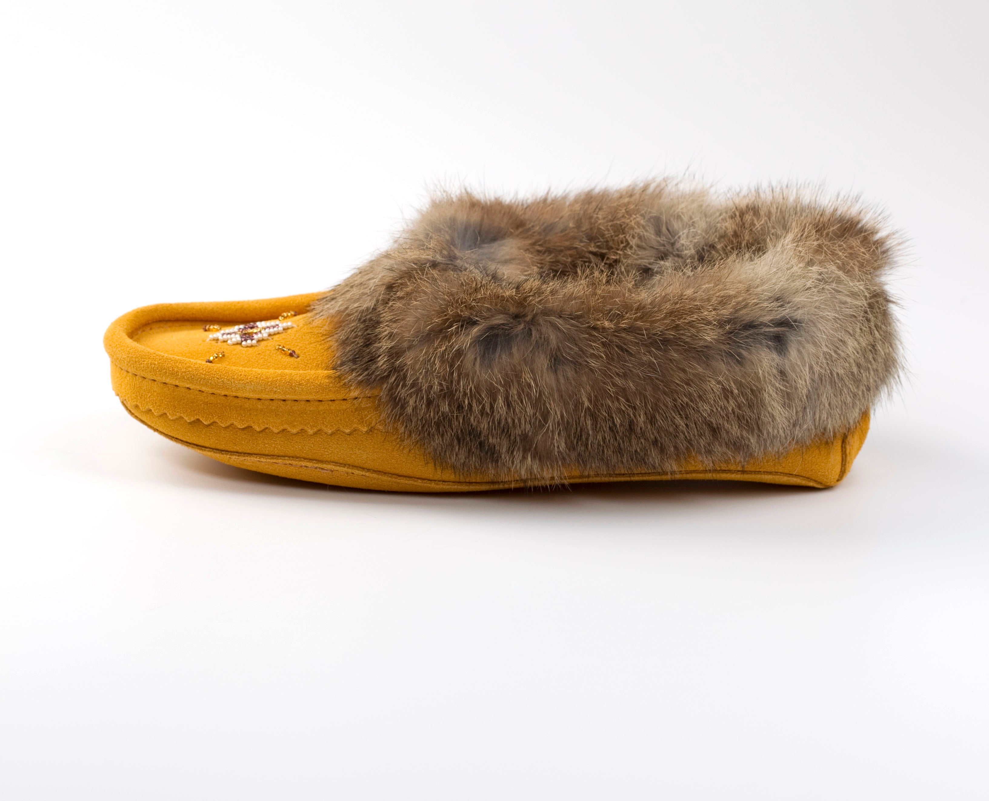 Yellow slipper with fur on a white background