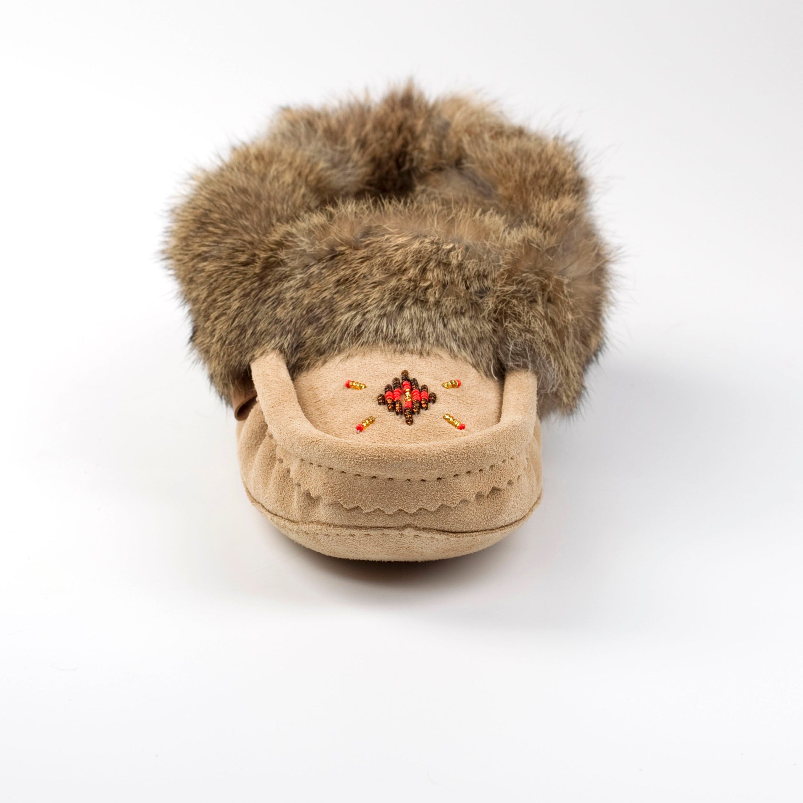 Beige slipper with fur trim on a white background