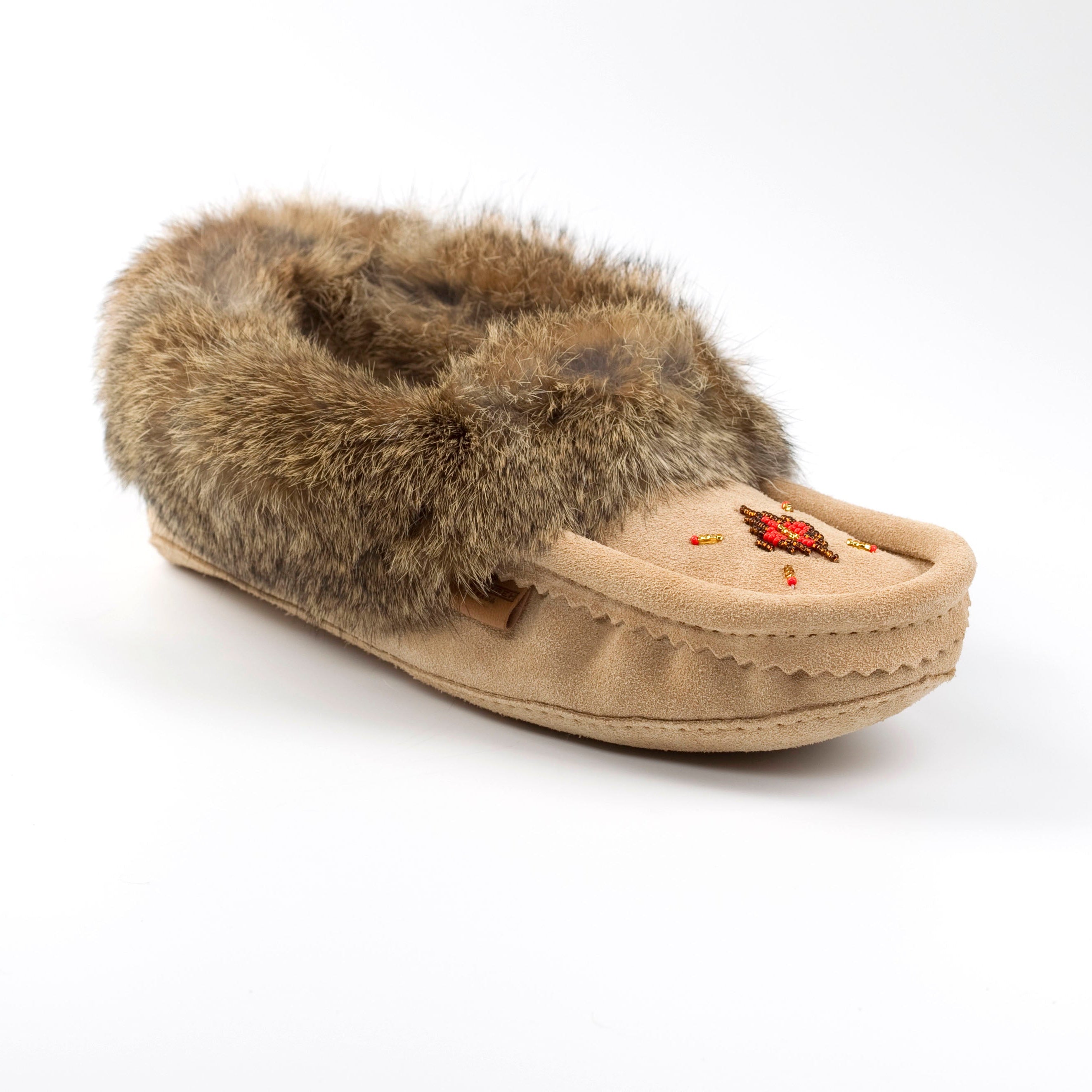 Beige slipper with fur trim on a white background