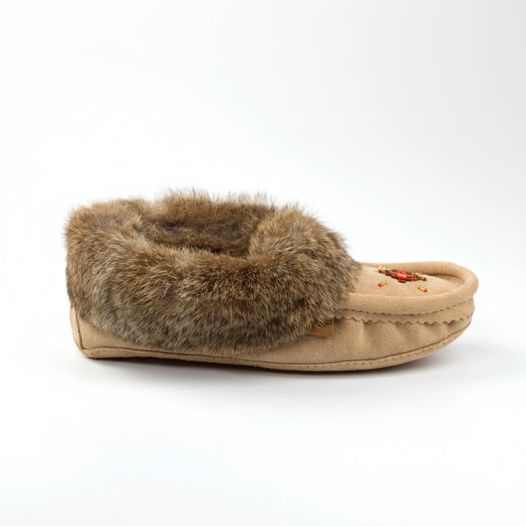Beige slipper with fur trim on a white background