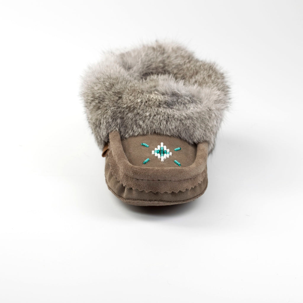 grey moccasin with fur on a white background