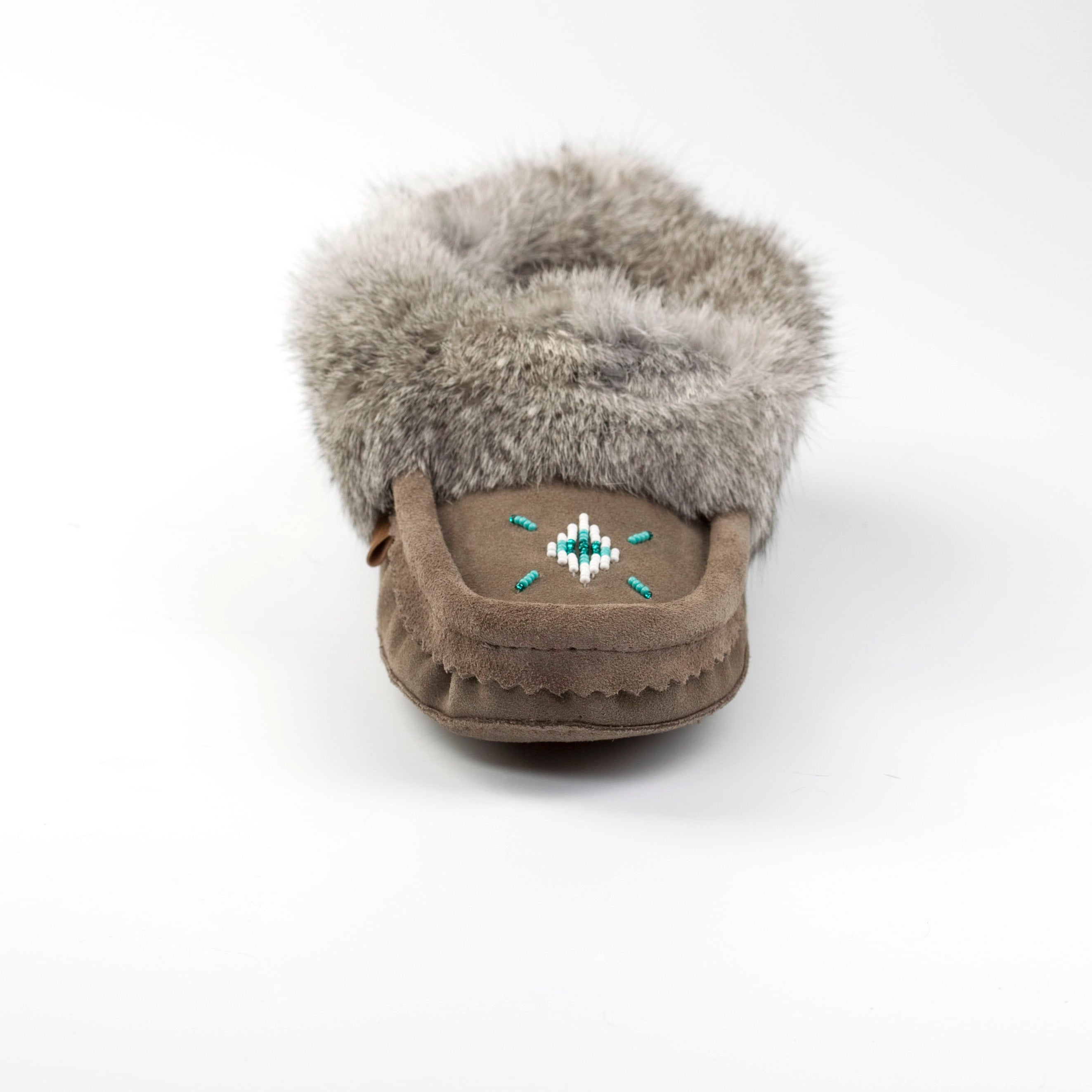 grey moccasin with fur on a white background