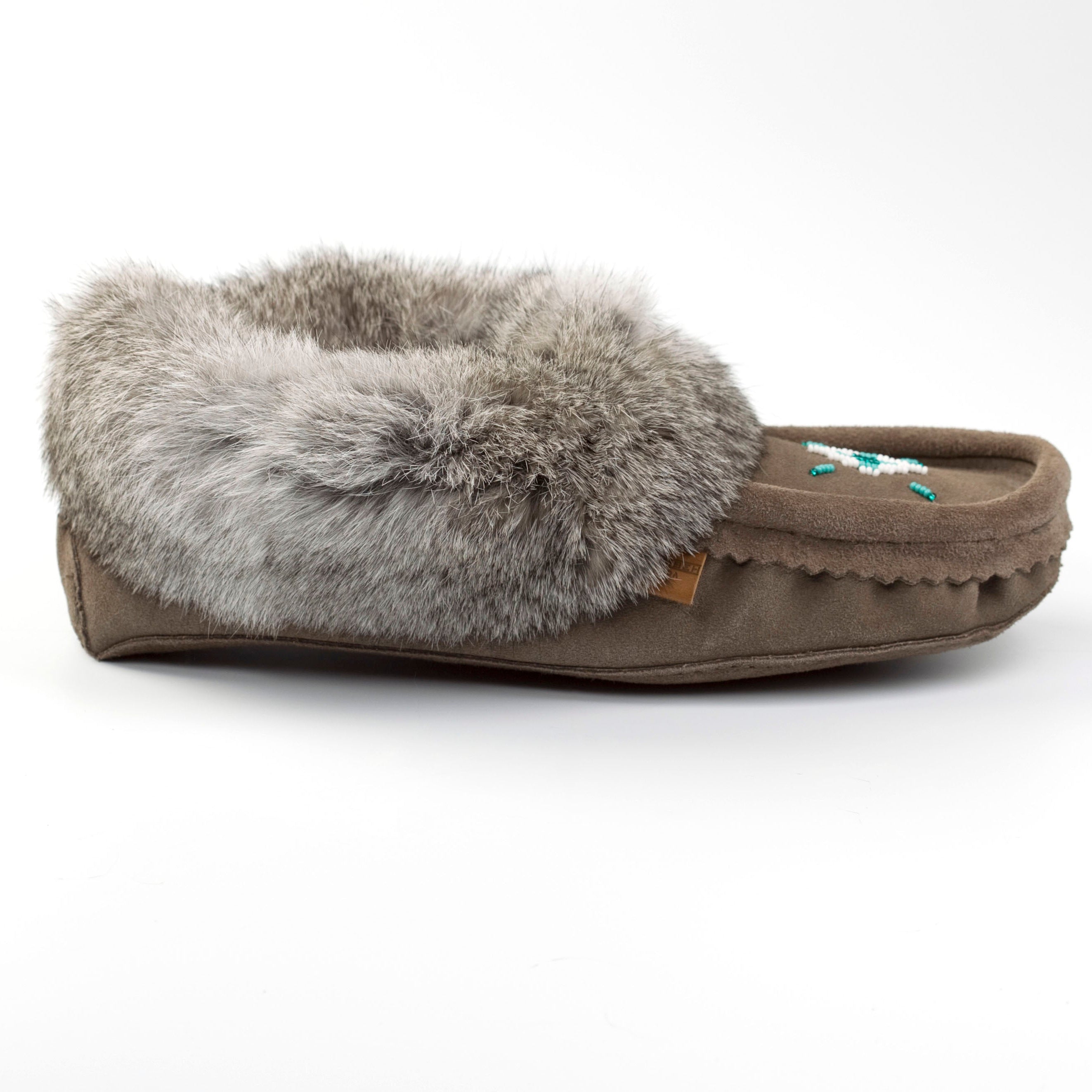 Charcoal grey moccasin slipper with gray fur on a white background