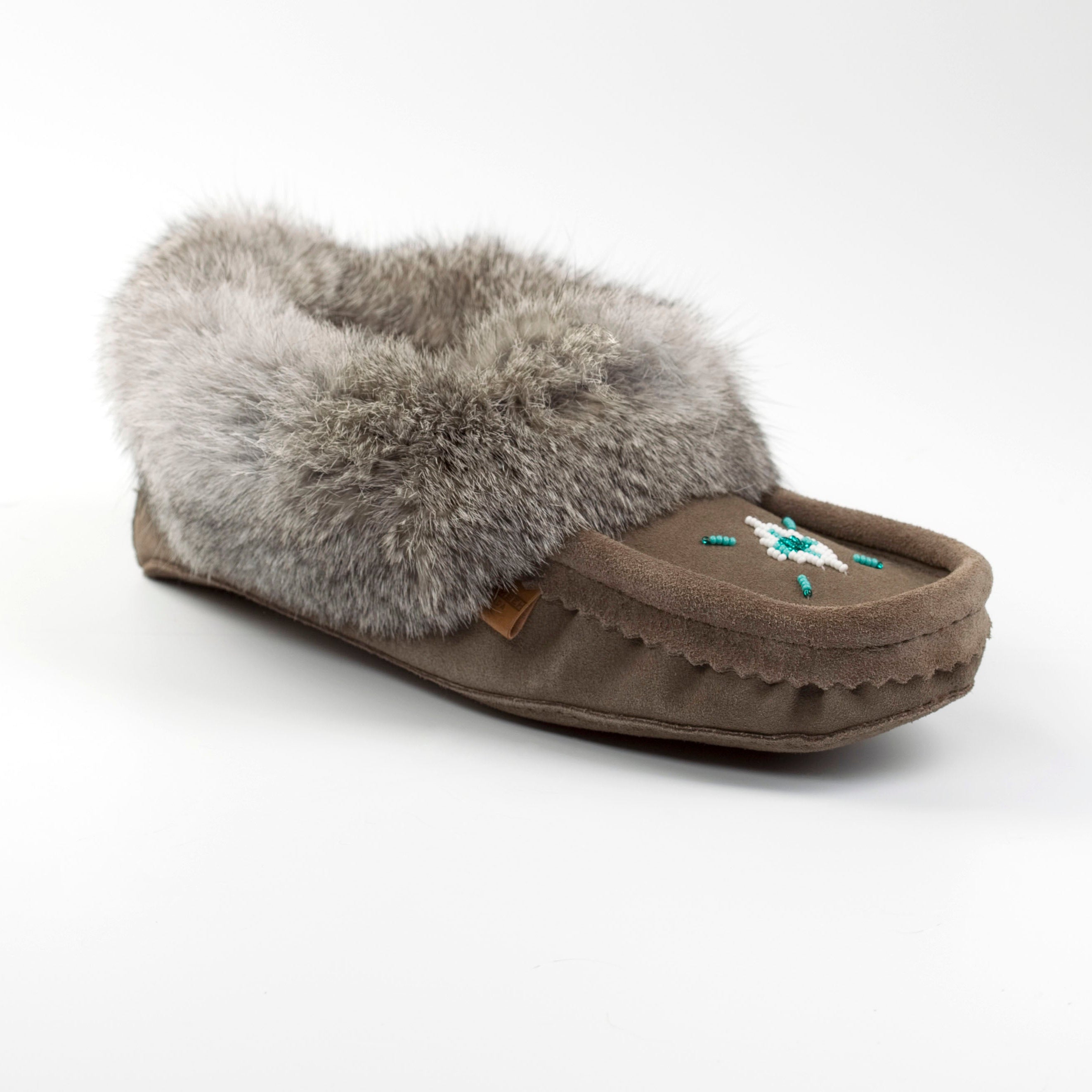 grey slipper with gray fur on a white background