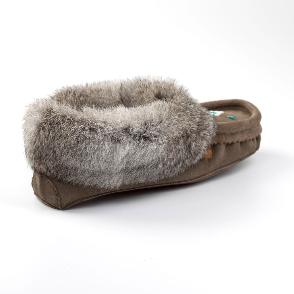 Brown slipper with gray fur lining on a white background