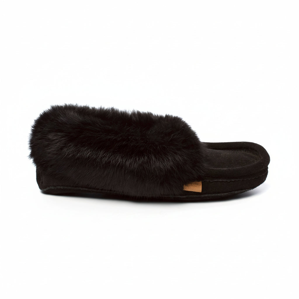 Black slipper with fur trim on a white background