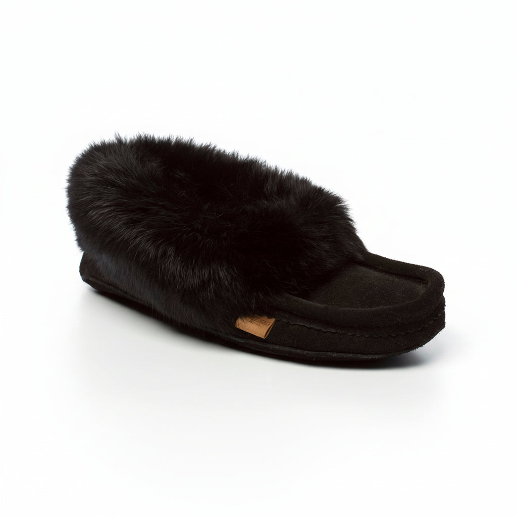 Black slipper with fur trim on a white background