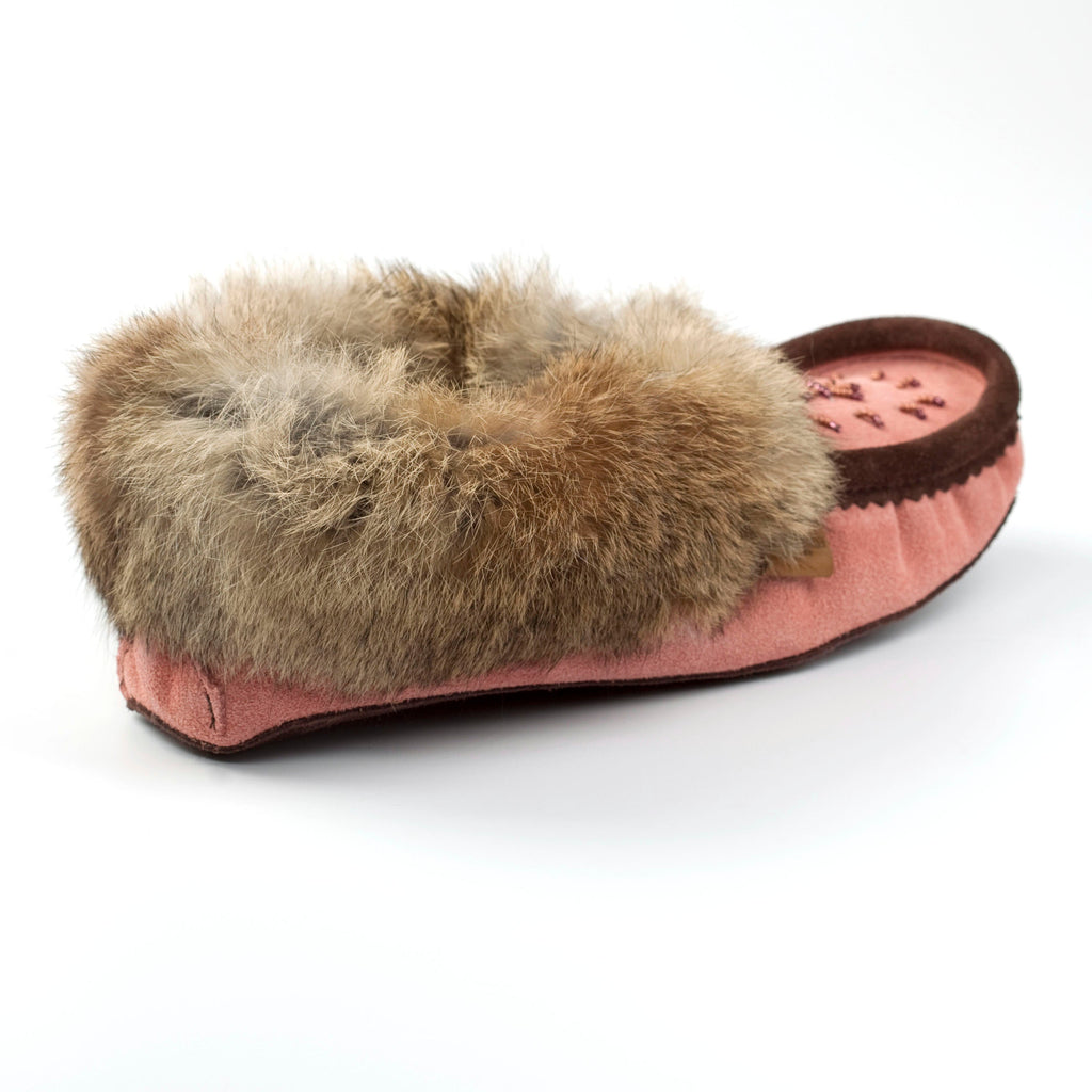 Pink slipper with brown fur trim on a white background