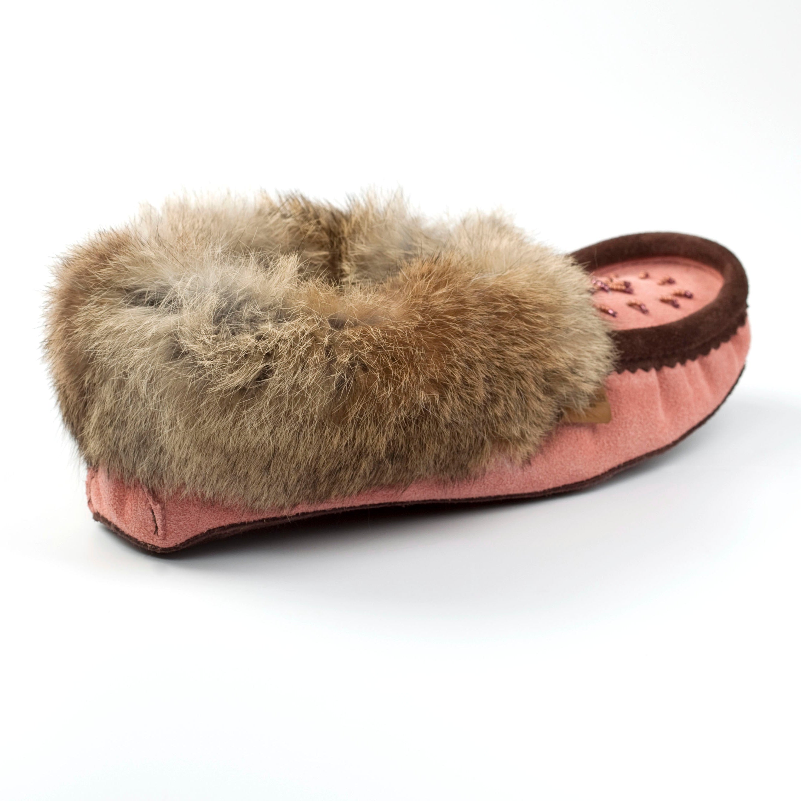 Pink slipper with brown fur trim on a white background
