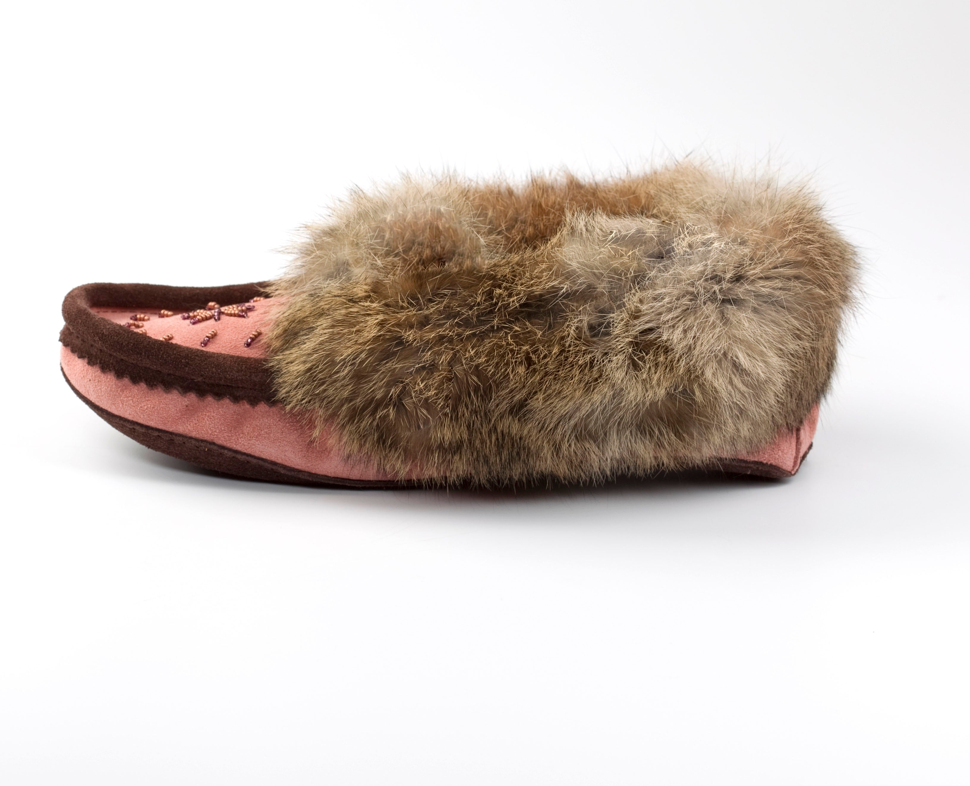 Pink slipper with fur trim on a white background