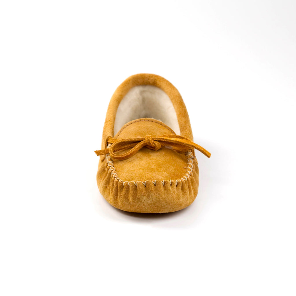 Yellow moccasin shoe on a white background