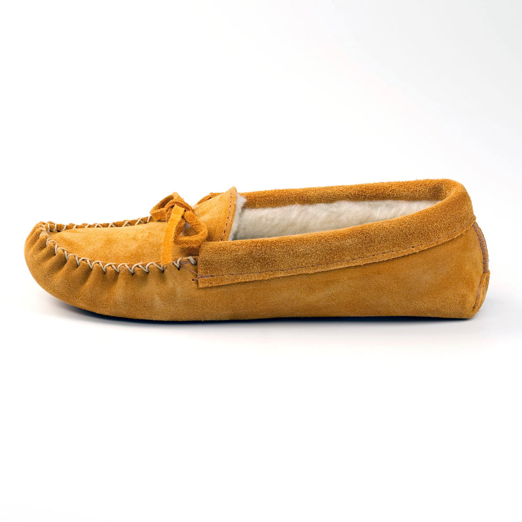 Tan moccasin slipper on a white background