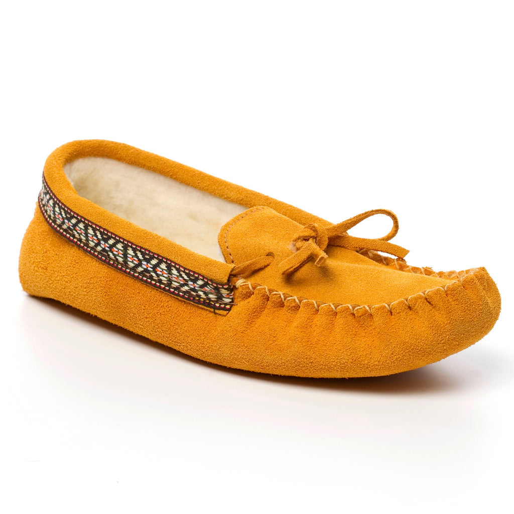 Yellow moccasin slipper with a decorative band on a white background