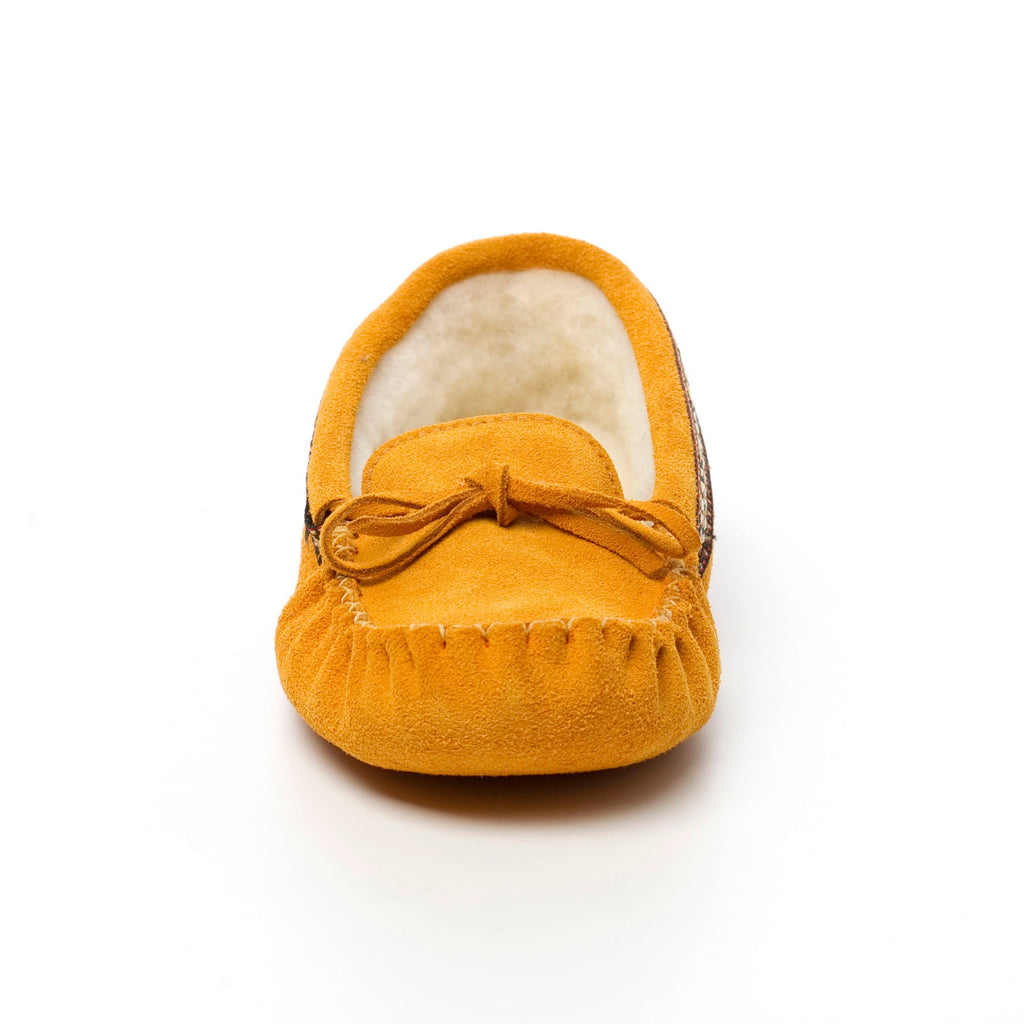 Yellow suede moccasin slipper with bow on a white background