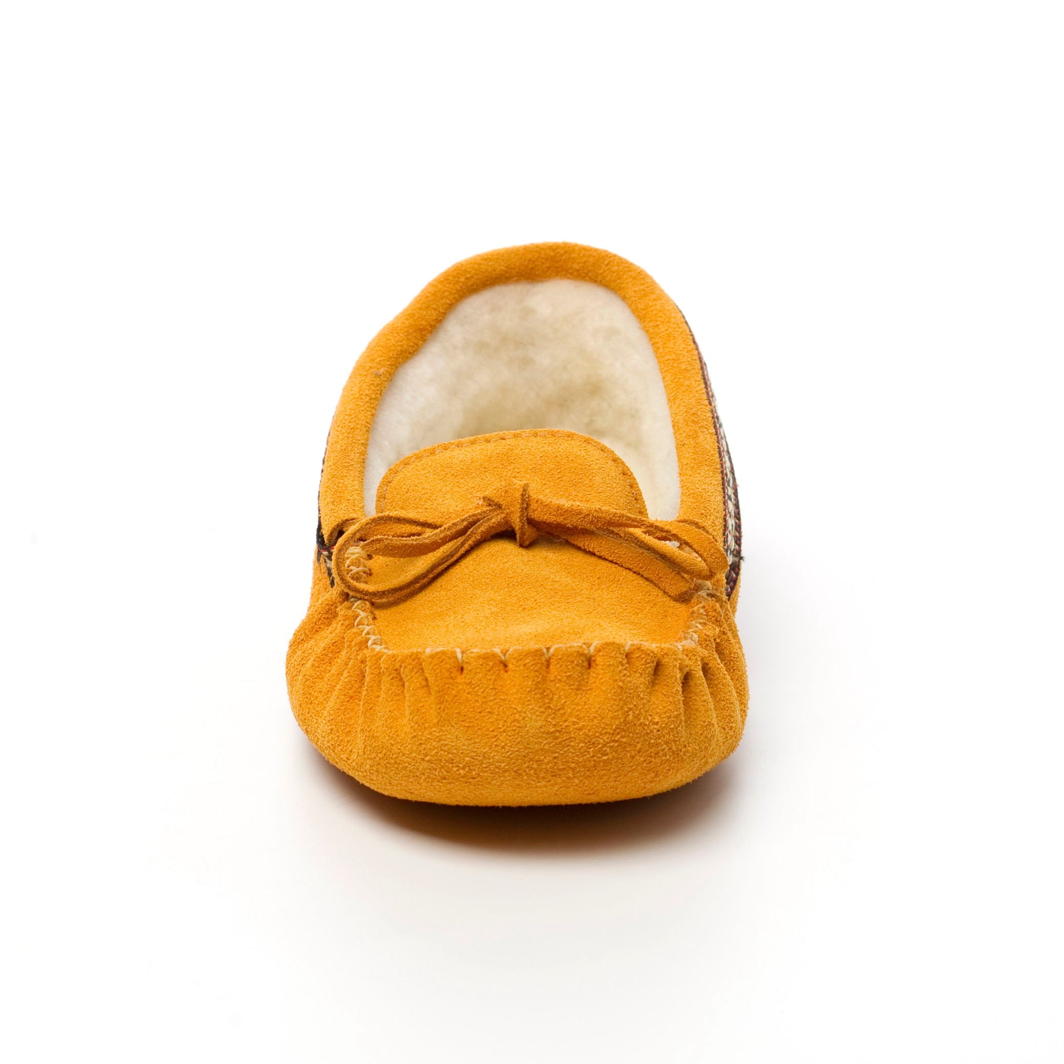 Yellow suede moccasin slipper with bow on a white background