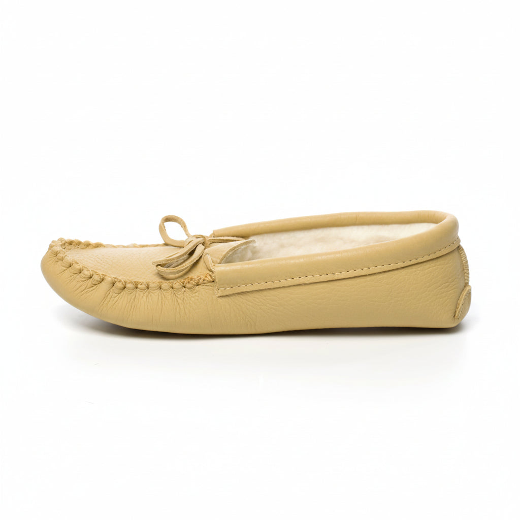 Beige moccasin slipper on a white background