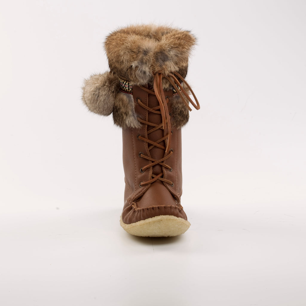 Brown winter boot with fur trim on a white background
