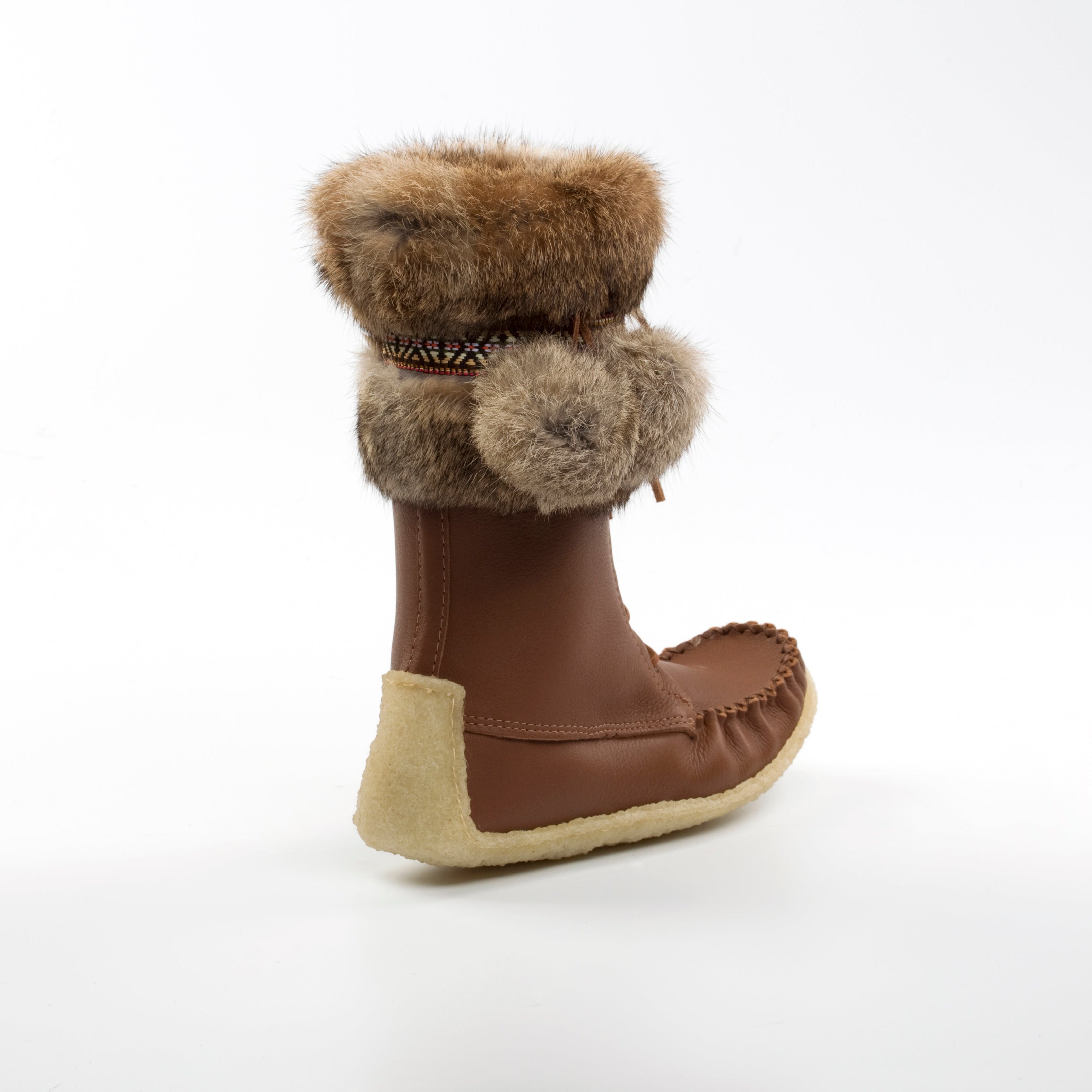 Brown winter boot with fur cuff on a white background