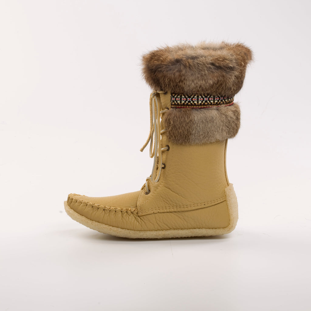 Beige winter boot with fur cuff on a white background
