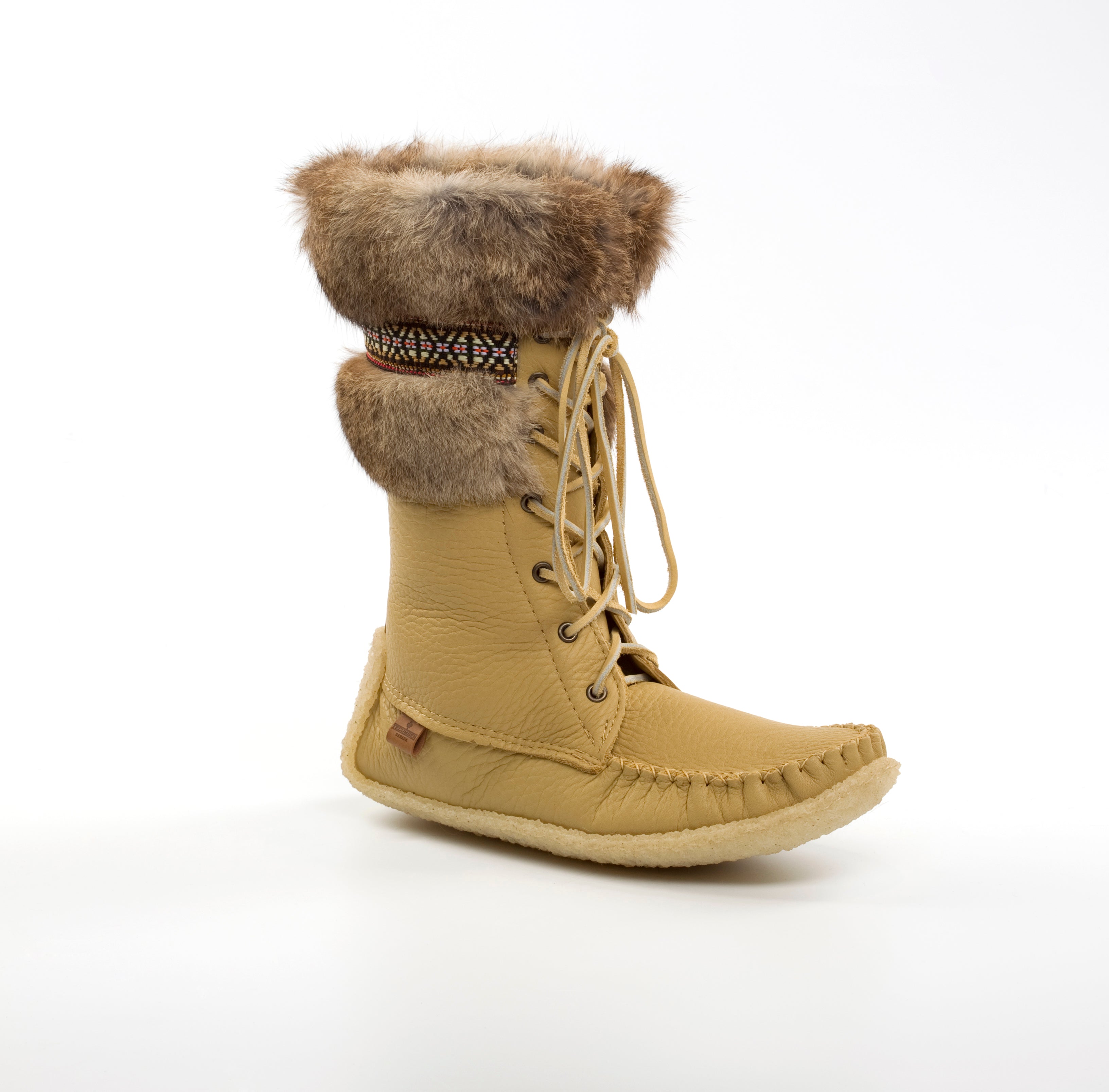Tan winter boot with fur trim on a white background