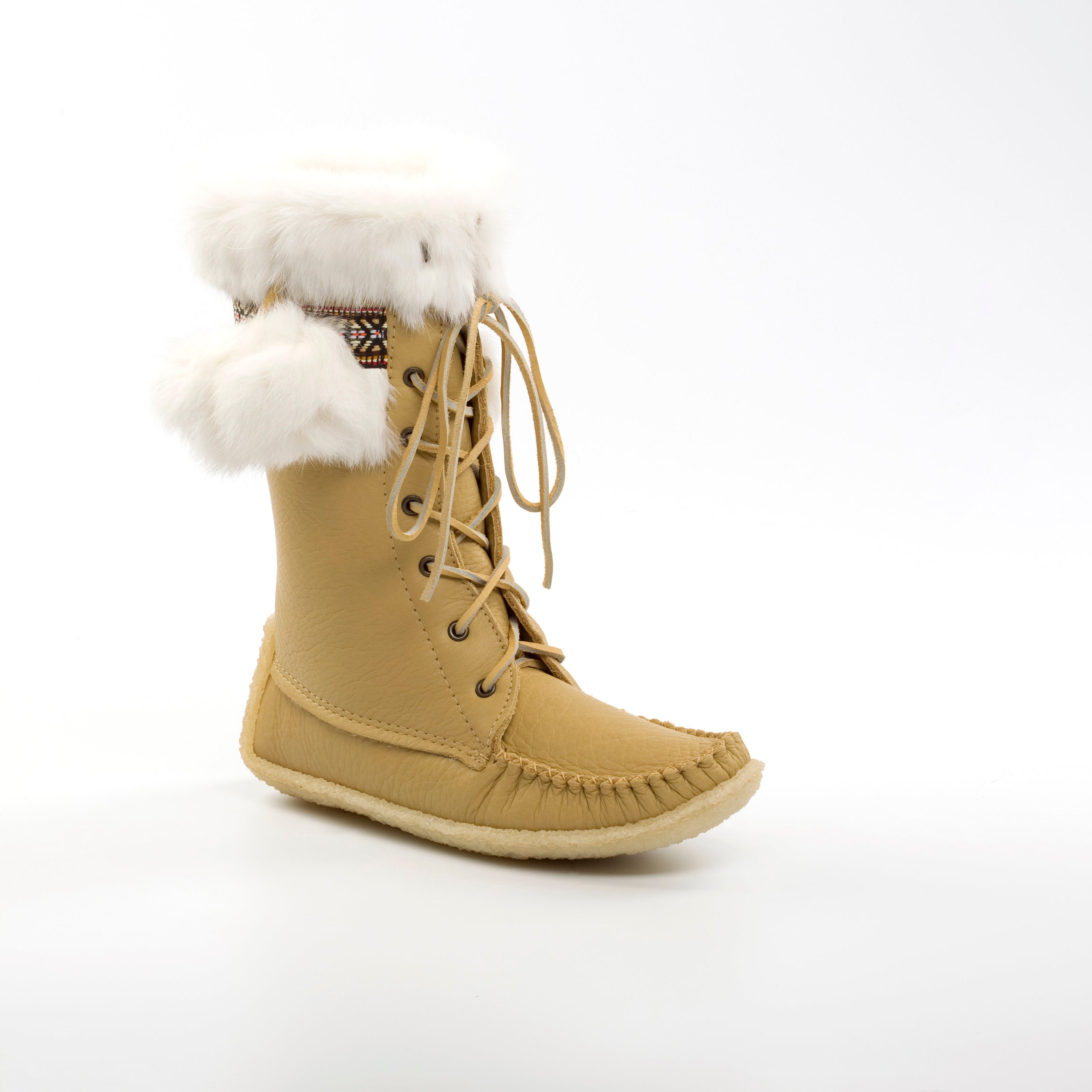Tan winter boot with white fur lining on a white background