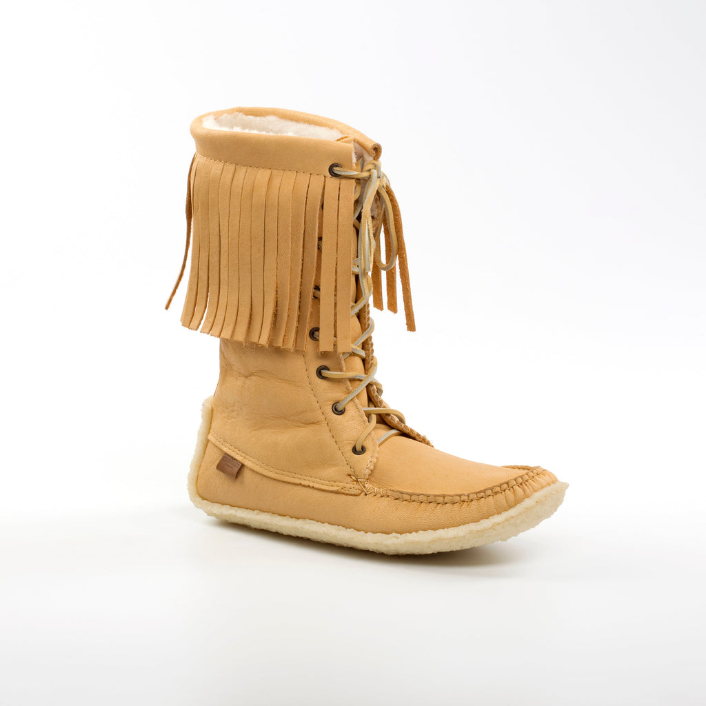 Tan fringed boot on a white background