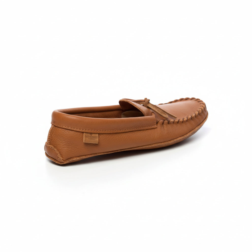 Brown leather moccasin shoe on a white background