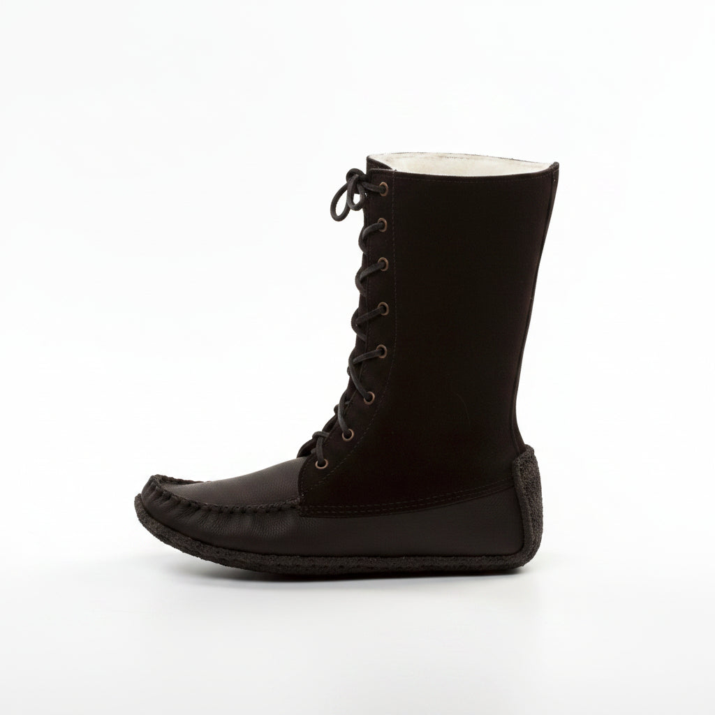 Black boot with white lining on a white background