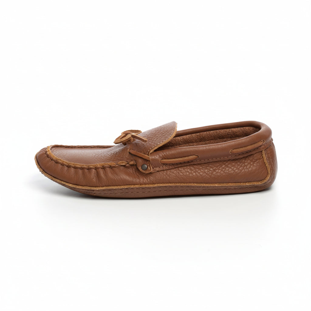 Brown leather moccasin shoe on a white background