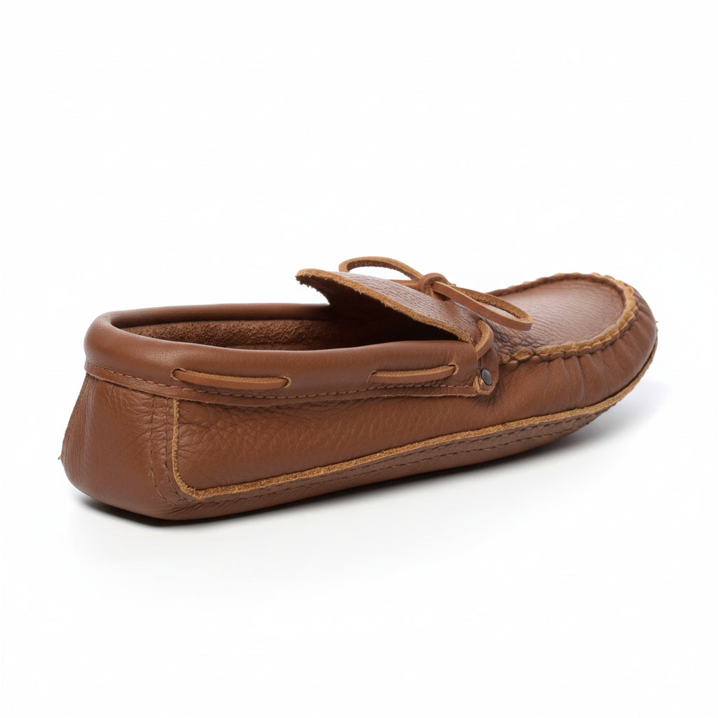 Brown leather moccasin shoe on a white background